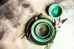 Summer table setting with teal plates lavender flowers