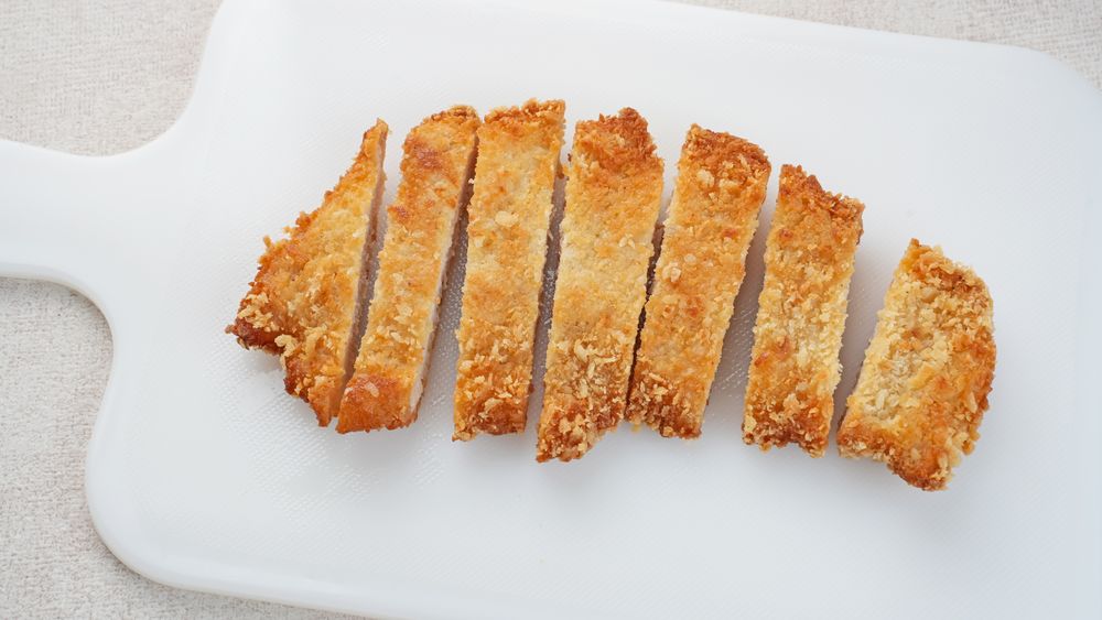 Deep fried chicken cutlet tonkatsu, Japanese food on light background