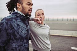 Beautiful woman leaning on her boyfriend and looking away