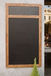 Empty chalkboard near cafe