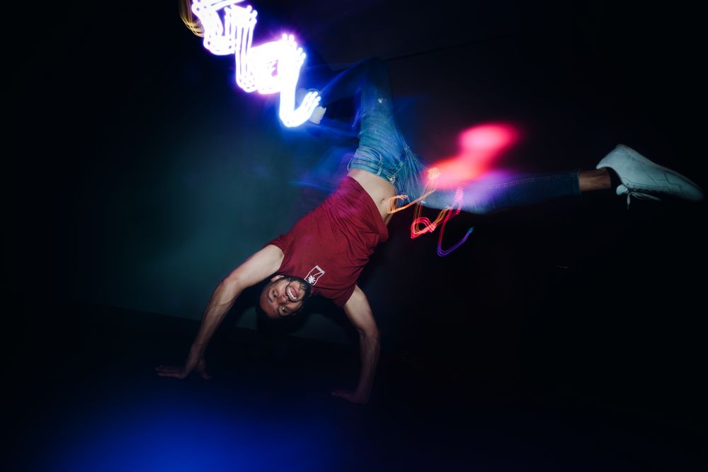 Man performing dance in spotlights