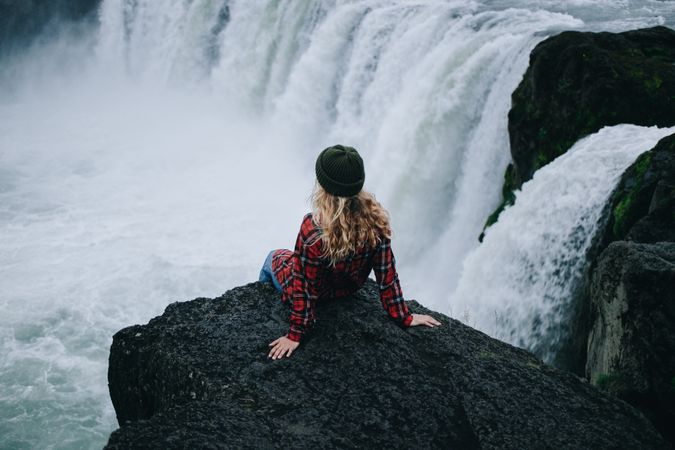 Back of female overlooking waterfall