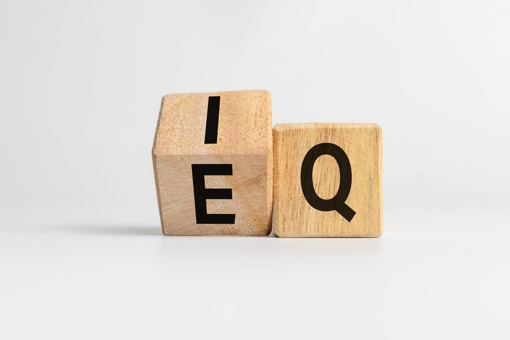 intelligence quotient and emotional quotient or iq and eq letter symbol on flip wooden cubes