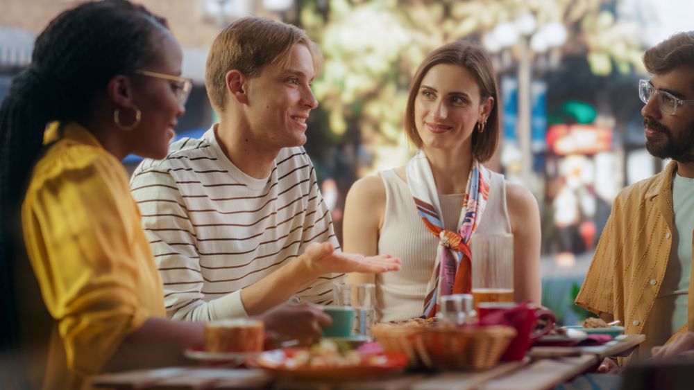 Multiethnic Young Men and Women Having Joyful Conversations