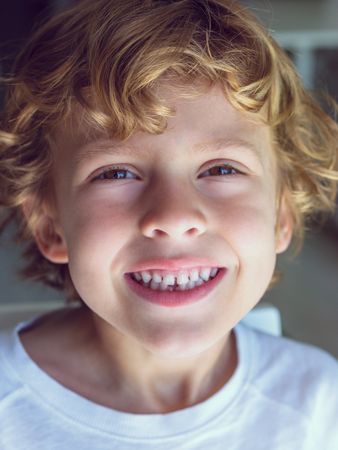 Happy little boy smiling at camera