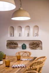 Served table with burning lamps above