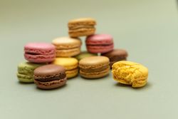 Delicious macaroons with a green background