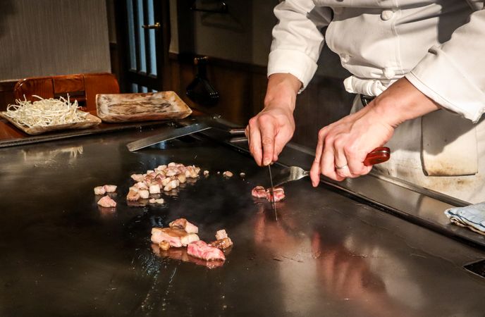 Chef preparing Japanese food on grill