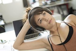 Dreamy female relaxing in home office