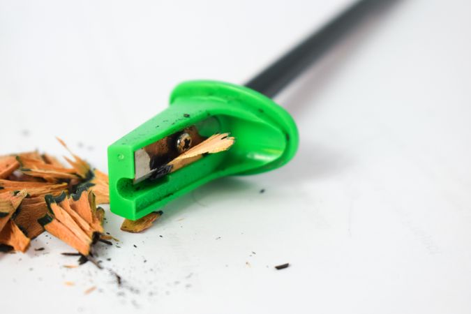 Green pencil sharpener with space for text