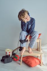 Upset kid in headphones losing video game
