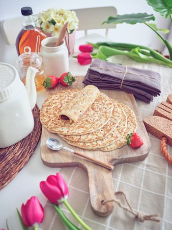 Delicious tasty homemade crepes on kitchen desk