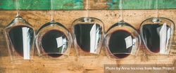 Glasses of red wine glasses laying on wooden background, wide composition 56NJd5