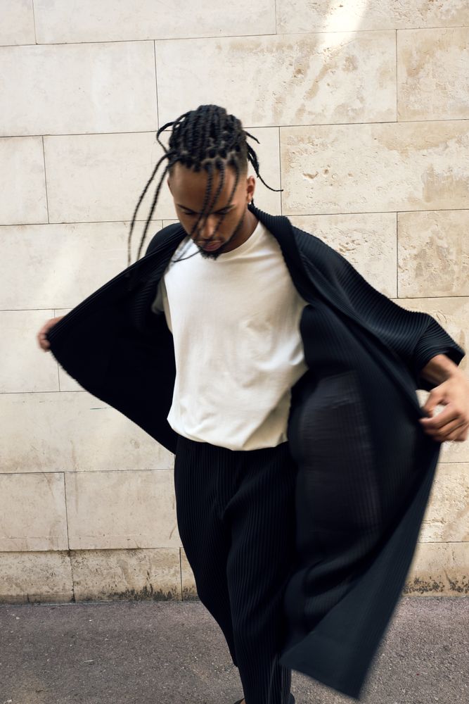 Trendy Black man posing on street
