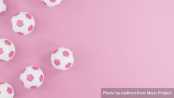 Pink soccer balls on pink background with copy space 0J3ld5