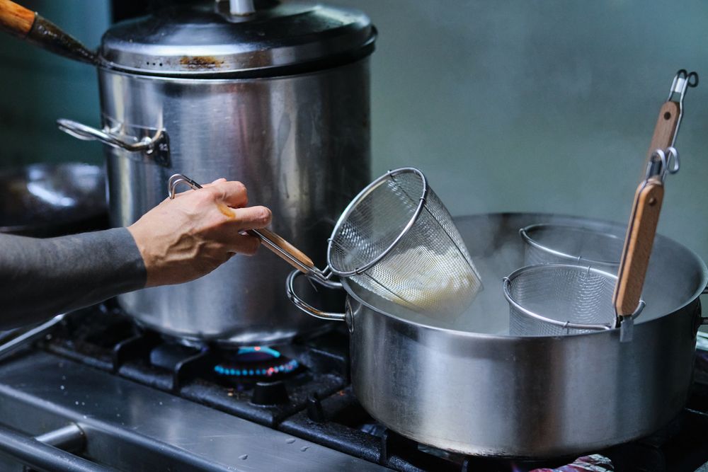 Chef Cooking in Japanese Restaurant
