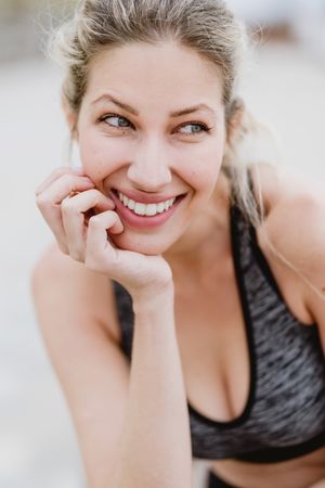 Sportswoman in active clothing smiling