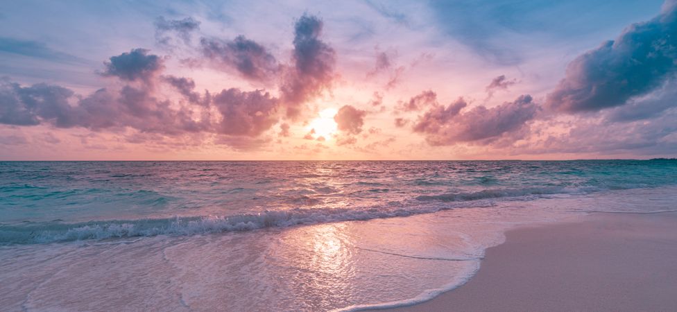 Colorful sunset over the beach, wide shot