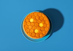Medovik, honey layered cake, above view on a blue background