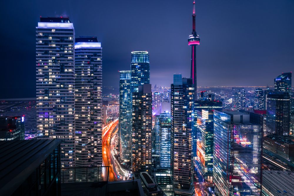 Tall buildings lit at night