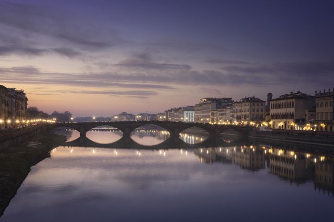 Carraia medieval Bridge on Arno river at sunset, Florence, Italy
