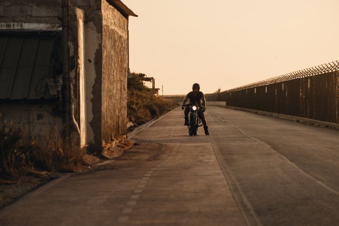 Strong man driving motorcycle