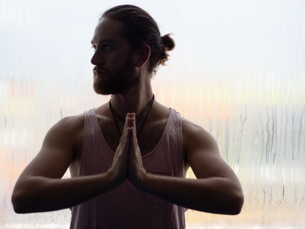 Man in mindfulness on window sill
