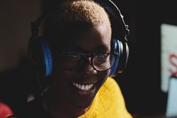 Smiling Black woman in headset