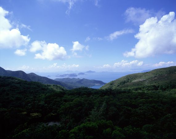 Lush landscape in Hong Kong with sky, clouds and mountains