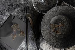 Table setting with delicate dried flower and envelope
