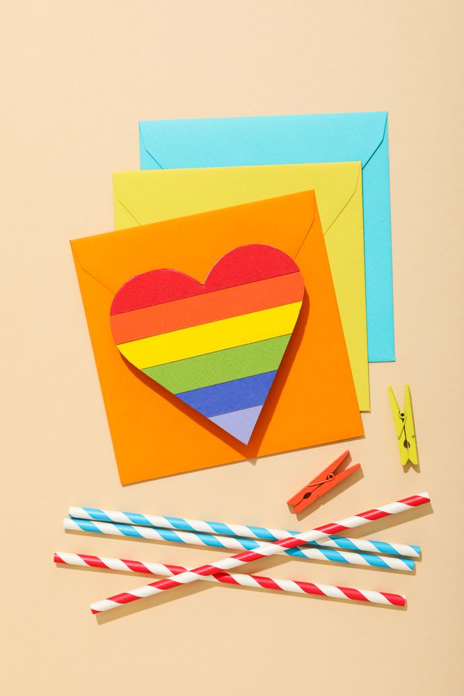 Pride parade concept, free love symbol on light background.