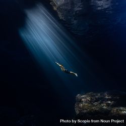 Silhouette of a person diving bGGzab