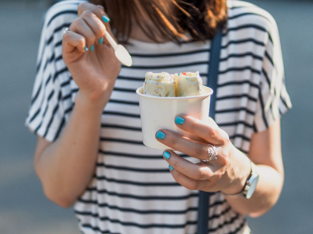 Woman eating ice-cream outdoor