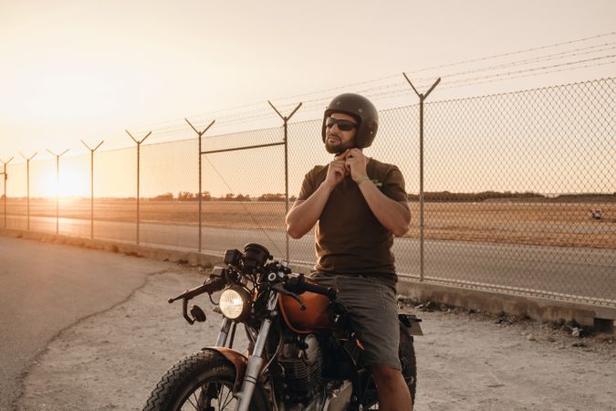 Strong man driving motorcycle