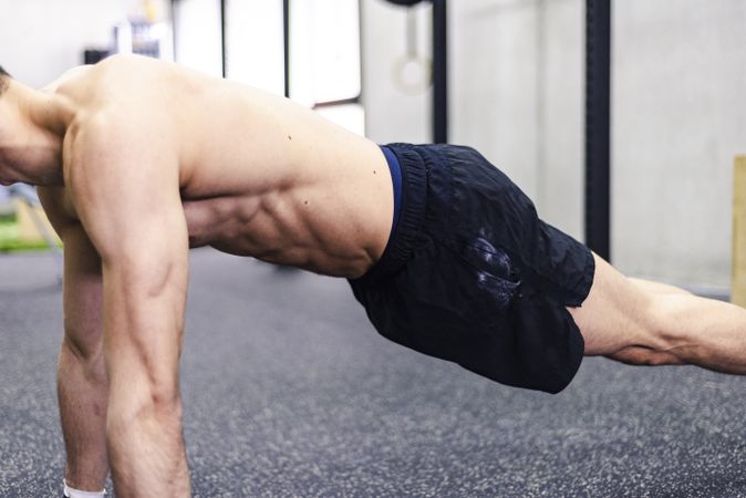 Man stretching in gym