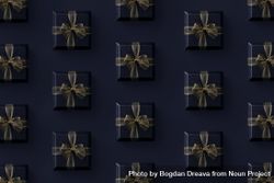 Gift boxes with gold ribbon on dark background 4j6Ax4