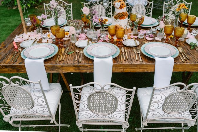 Wedding table decoration in rustic style placed outdoors