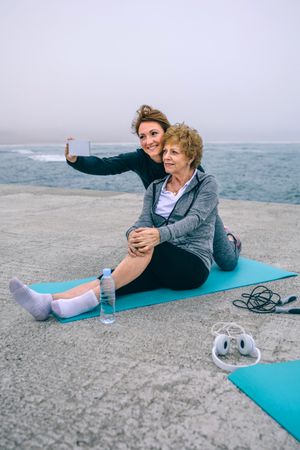 Older taking selfie with senior woman