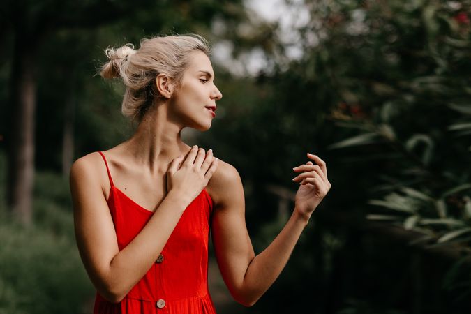 Dreamy young woman in summer garden