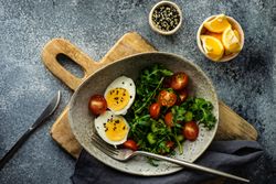 Top view of healthy salad with hard boiled egg