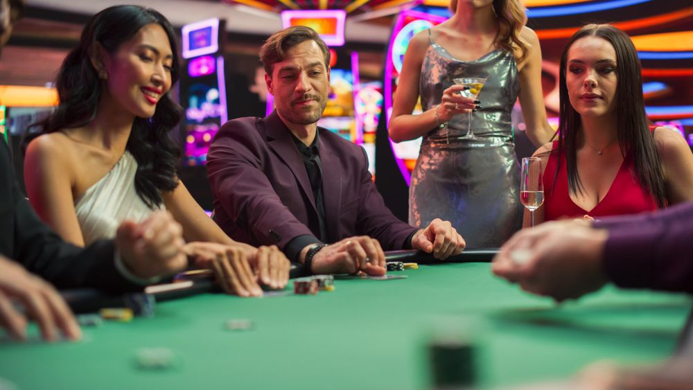 Diverse Group Playing Poker in a Luxurious Casino, Strategically Betting.