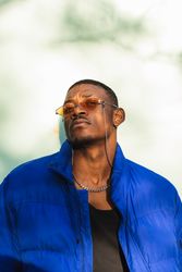 Stylish Black man in sunglasses on street