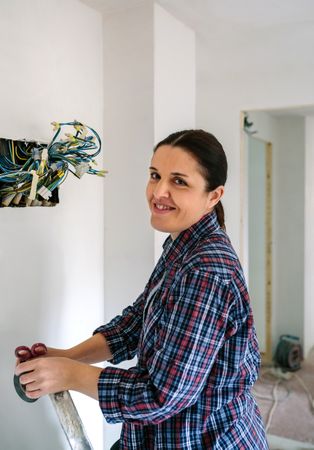Electrician working on the electrical installation of a house