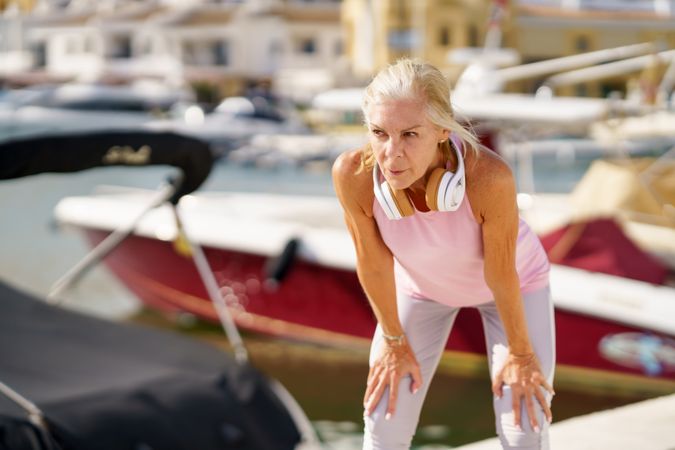 Older sportswoman taking a break during exercise