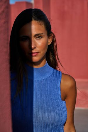 Woman looking at camera in sunlight