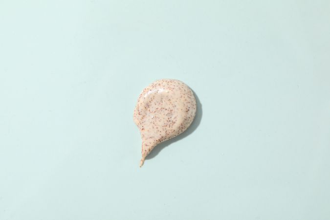 Scrub on light blue background, top view