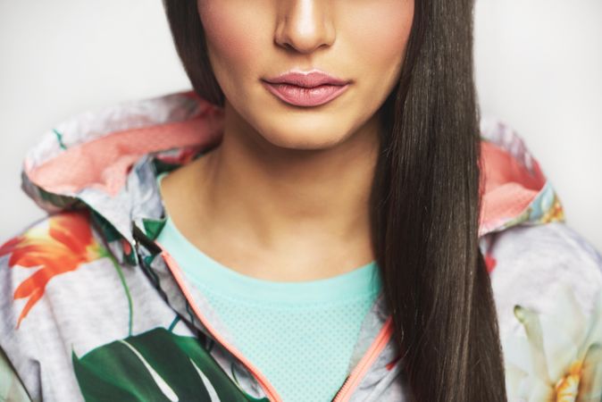 Beautiful woman pictured in colorful printed floral hoodie