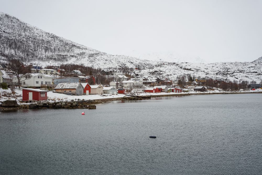 Picturesque town in calm lake in winter