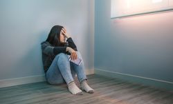 Woman holding mobile desperate for social networks problems