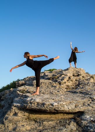 Women dancing near stones